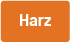 Orangenes Farbbandsymbol mit weißer Aufschrift „Harz“ – Kennzeichnung für Thermotransferbänder mit hohem oder reinem Harzanteil.